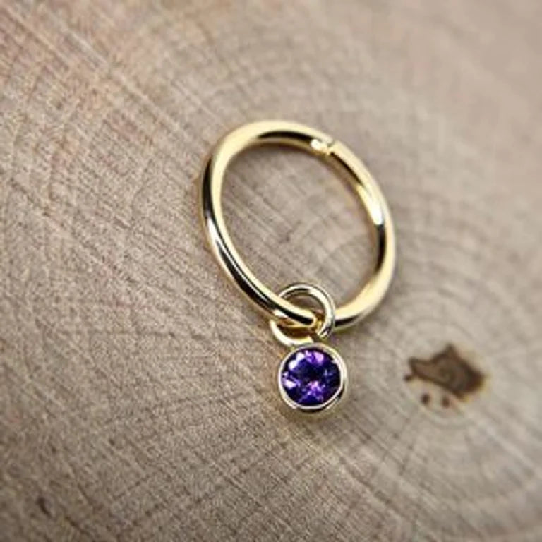 Amethyst charm on a yellow gold hoop